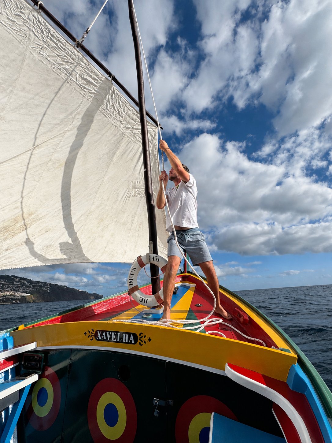 Bright painted bow and sail detail on the traditional boat