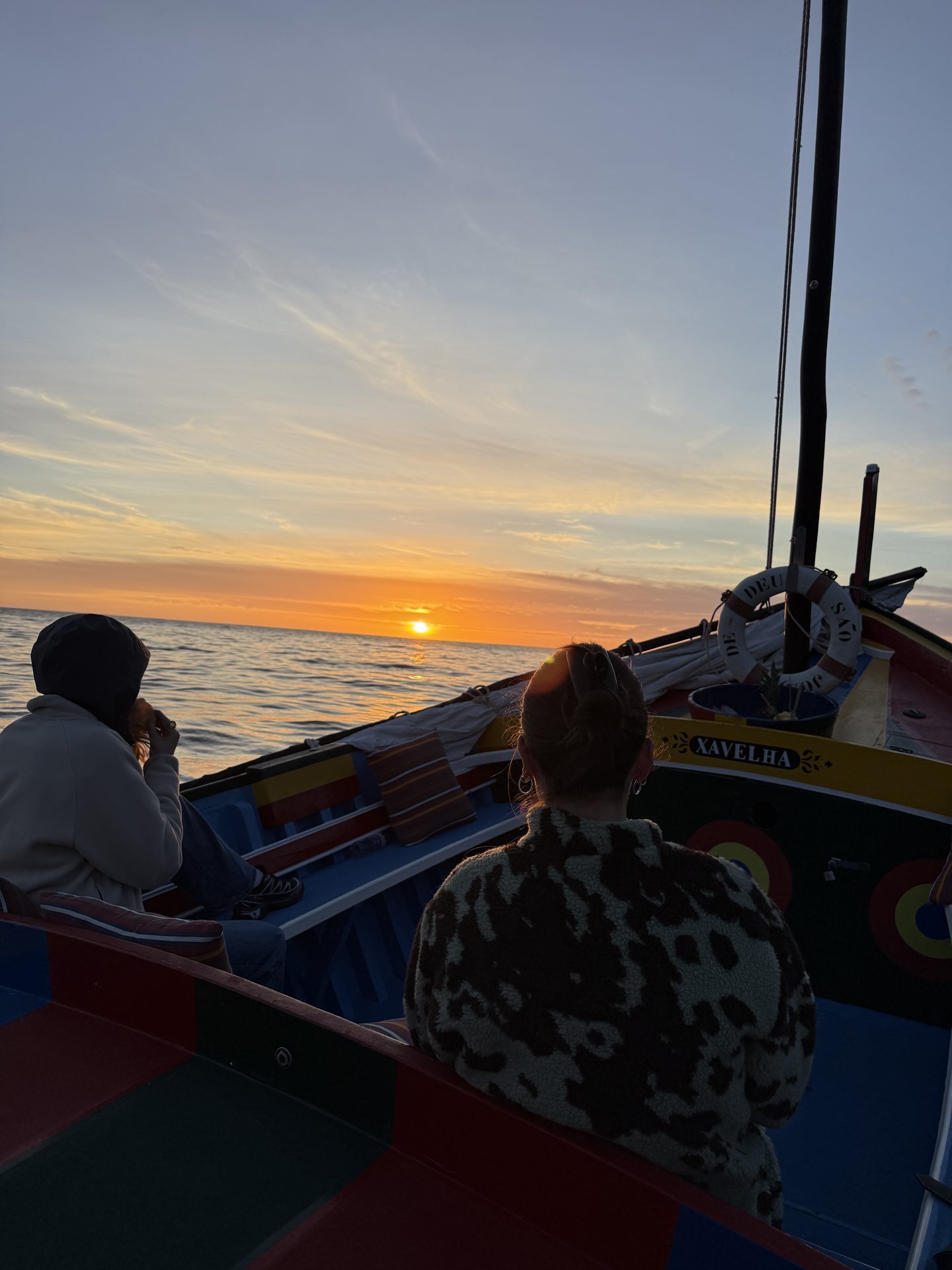 Guests relaxing on board during sunset